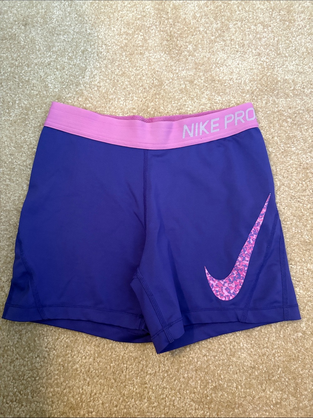 Nike Pro Women's Purple Athletic Shorts with Pink Waistband and Pink Swoosh